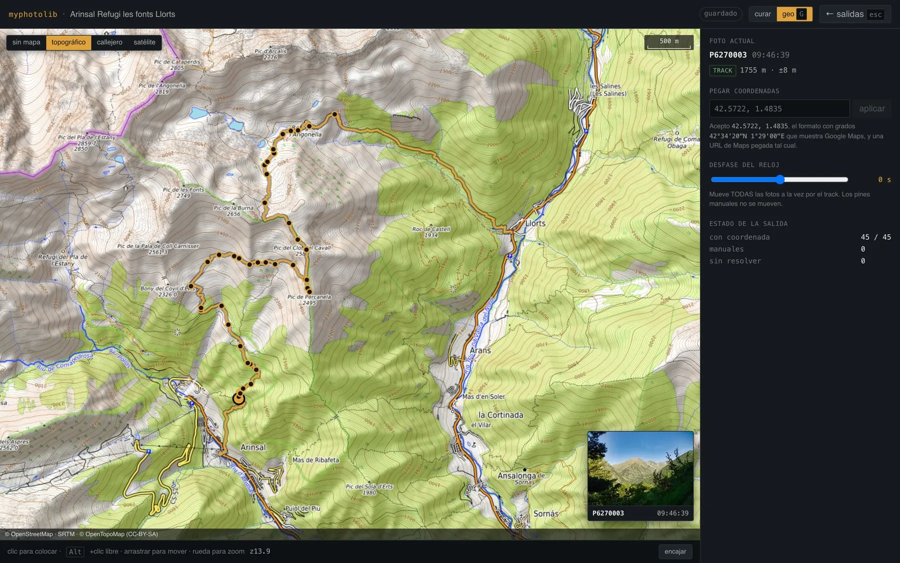 The geolocation view: the Arinsal track drawn in amber over an OpenTopoMap basemap with a pin per photo, and a side panel reading \